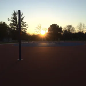 Empty playground with sun setting in the background.