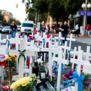 Memorial with 53 crosses in San Antonio honoring migrant victims.