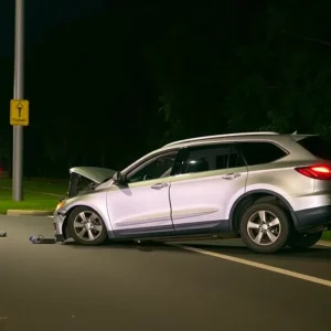 Crashed silver Audi Q5 on a parkway